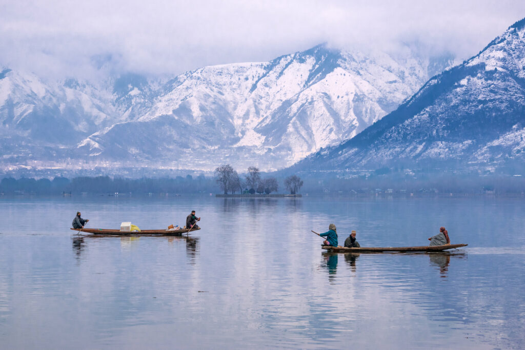 Beautiful view of a Shikara on Dal Lake, a must-visit destination during a Kashmir tour from Hyderabad